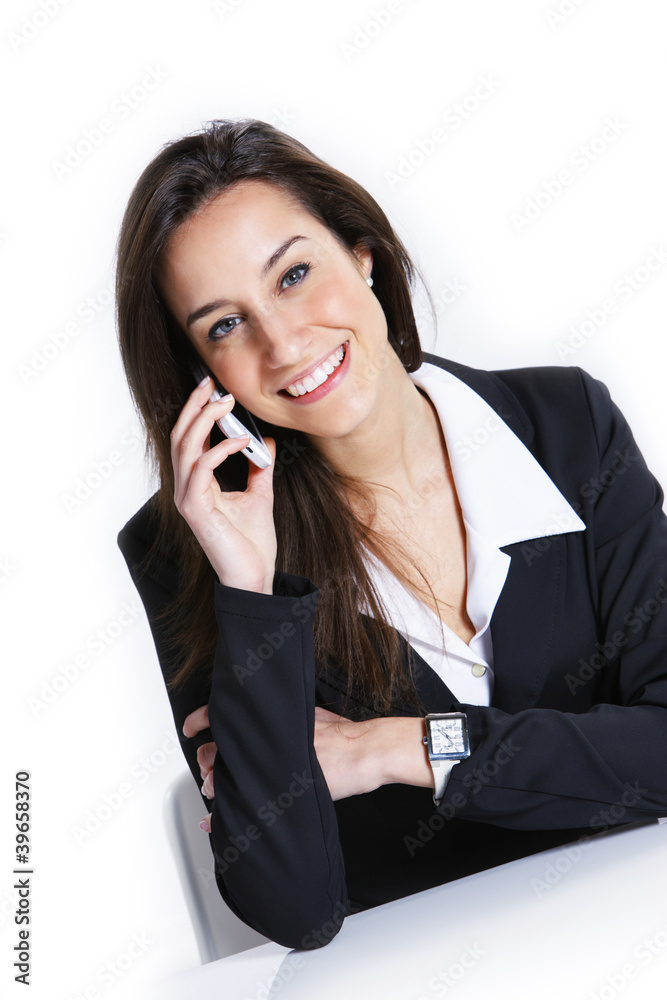 Close-up of a businesswoman talking on the mobile phone. Close-up of a businesswoman talking on the mobile phone.