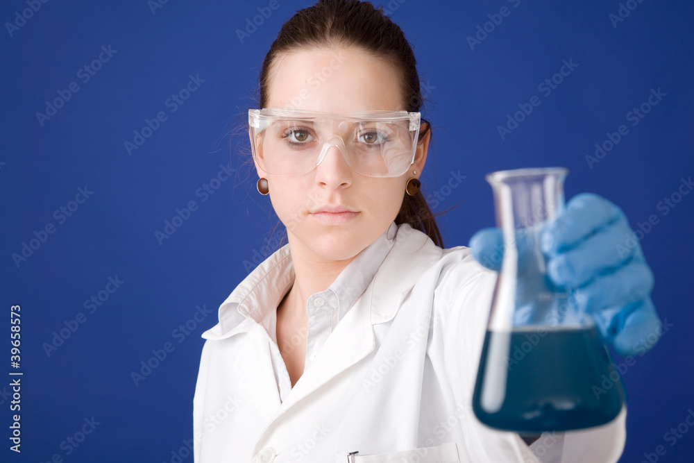 young female researcher against blue background young female researcher against blue background