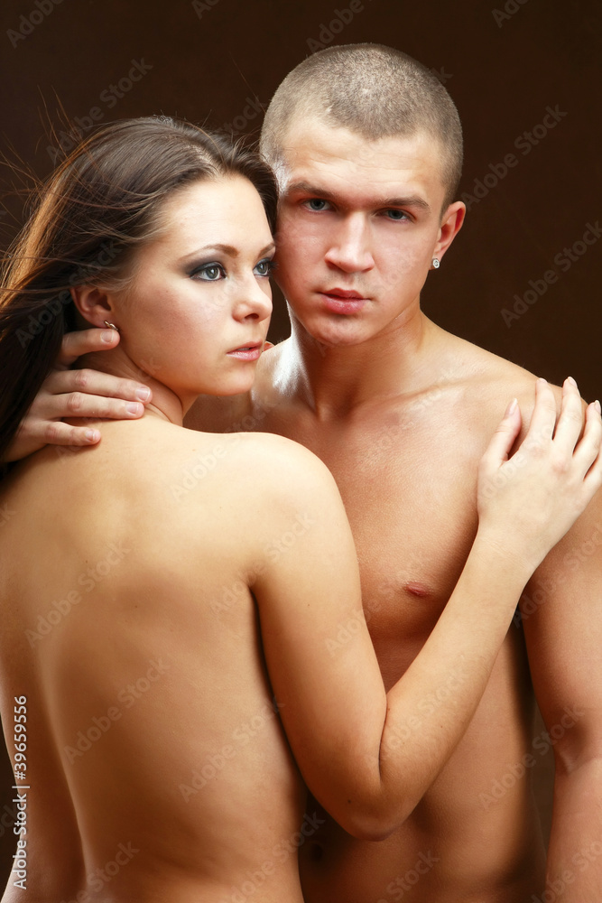 Passionate loving couple, isolated on dark background. Passionate loving couple, isolated on dark background.