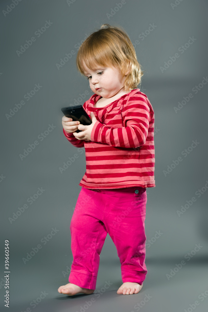 Cute little girl with mobile phone Cute little girl with mobile phone
