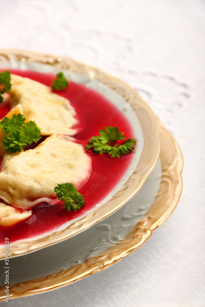 Delicious dumplings with champignon mushrooms stuffing in borsch Delicious dumplings with champignon mushrooms stuffing in borsch