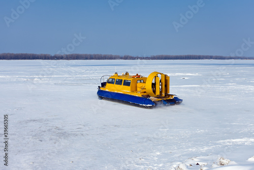 Bilde på lerret Hovercraft on the bank of a frozen river