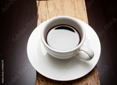 A white cup of black coffee