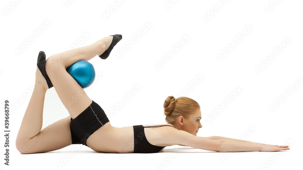 cute blond girl training with blue ball isolated cute blond girl training with blue ball isolated