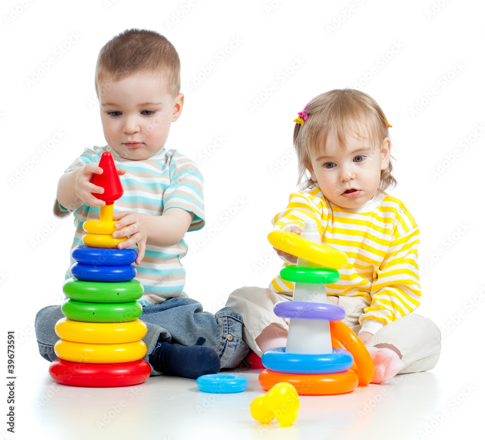 two little children playing with color toys two little children playing with color toys