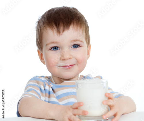 little child drinking yogur...