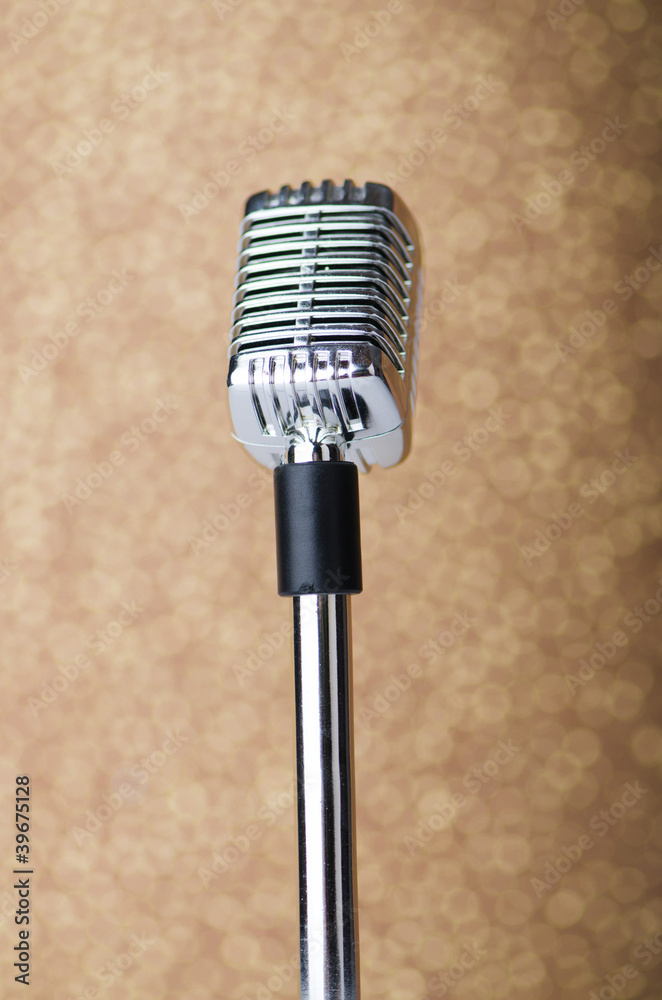 Fototapeta premium Old vintage microphone on background