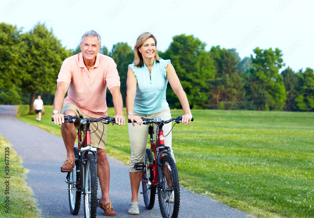 Senior couple cycling.