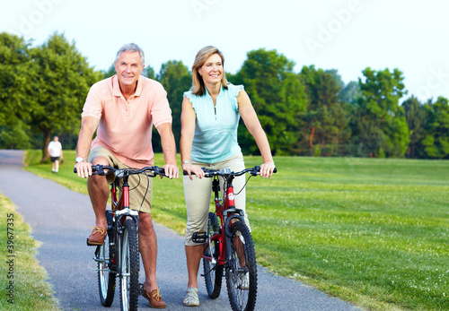 Senior couple cycling.