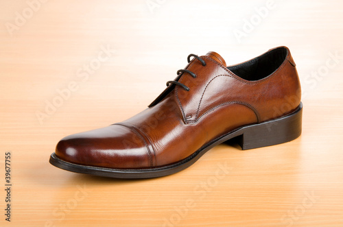 Brown shoes on wooden table