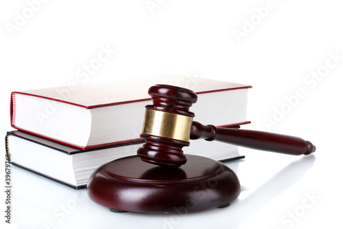 wooden gavel and books isolated on white