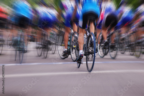 Blurred professional bike racers in a road race