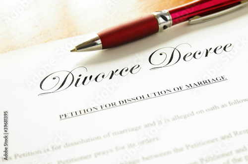 closeup of a divorce decree document with pen