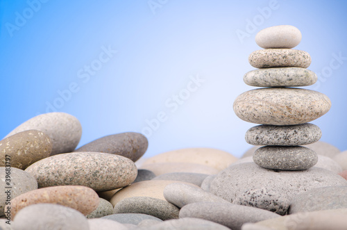 Pebbles stack against gradient background