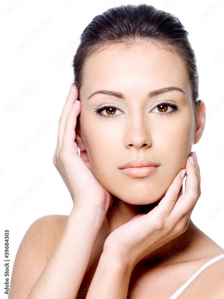 Beautiful woman stroking her clean face