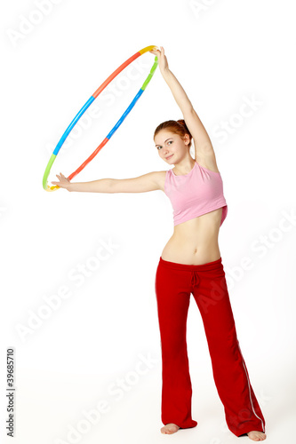 Young attractive woman holding hula hoop © fyb