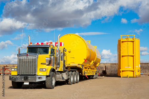 Yellow Transport With Oilfield Tanks