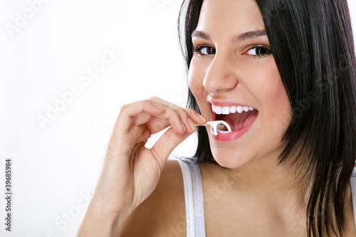 flossing his teeth