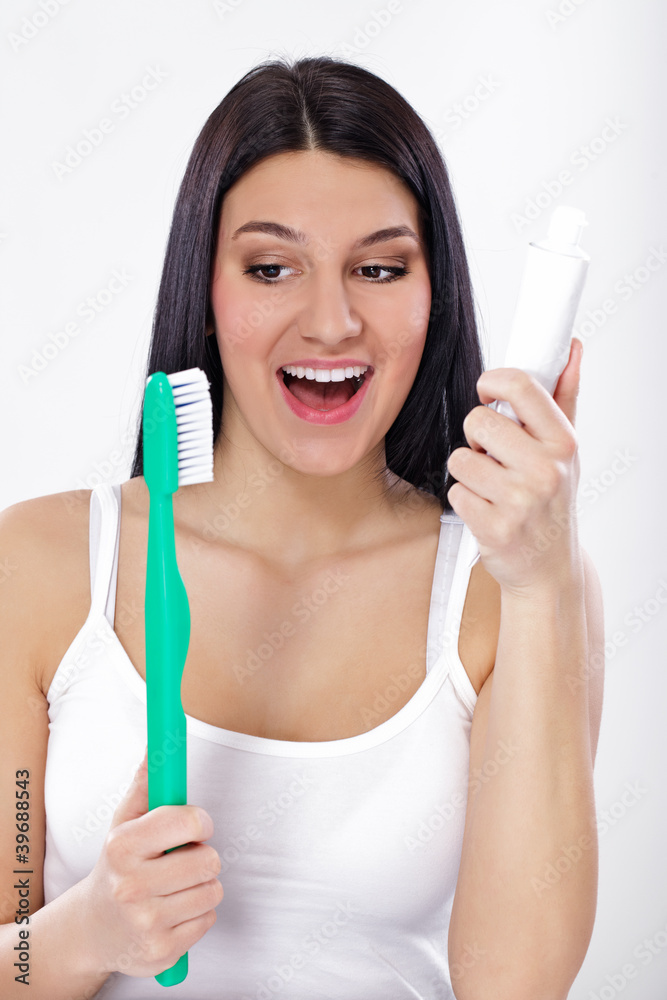Smiling girl with toothbrush and tooth paste Smiling girl with toothbrush and tooth paste