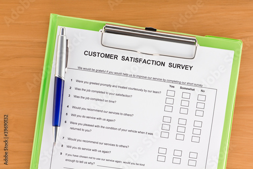 Customer Satisfaction Survey on Clipboard with Pen