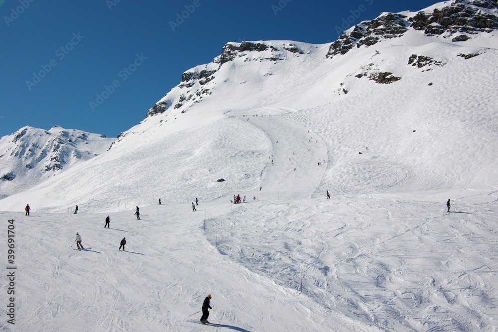 skiers on ski slopes in French Alps