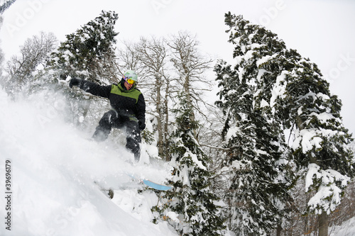 snowboarder on fresh deep snow