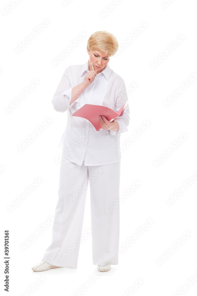The woman looks at a folder.