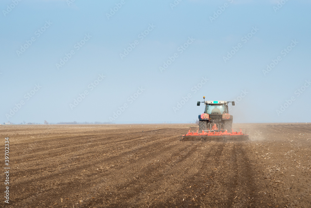 Fototapeta premium Tractor plowing