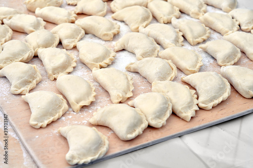 close-up of raw vareniks, traditional ukrainian food