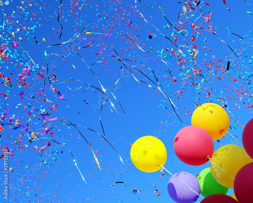 multicolored balloons and confetti
