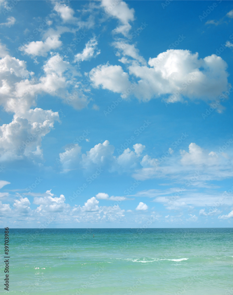 a background image of an open sea and blue sky