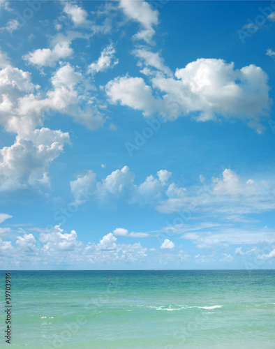 a background image of an open sea and blue sky
