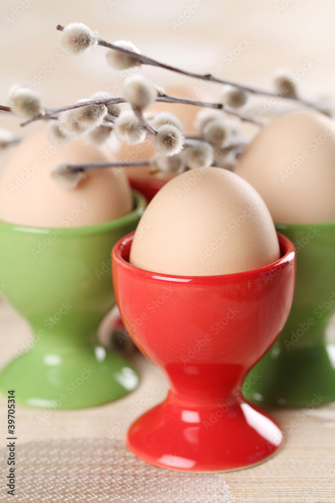 Eggs in red and green eggcups