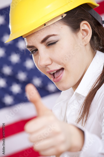 happy manual worker with thumb up sign photo