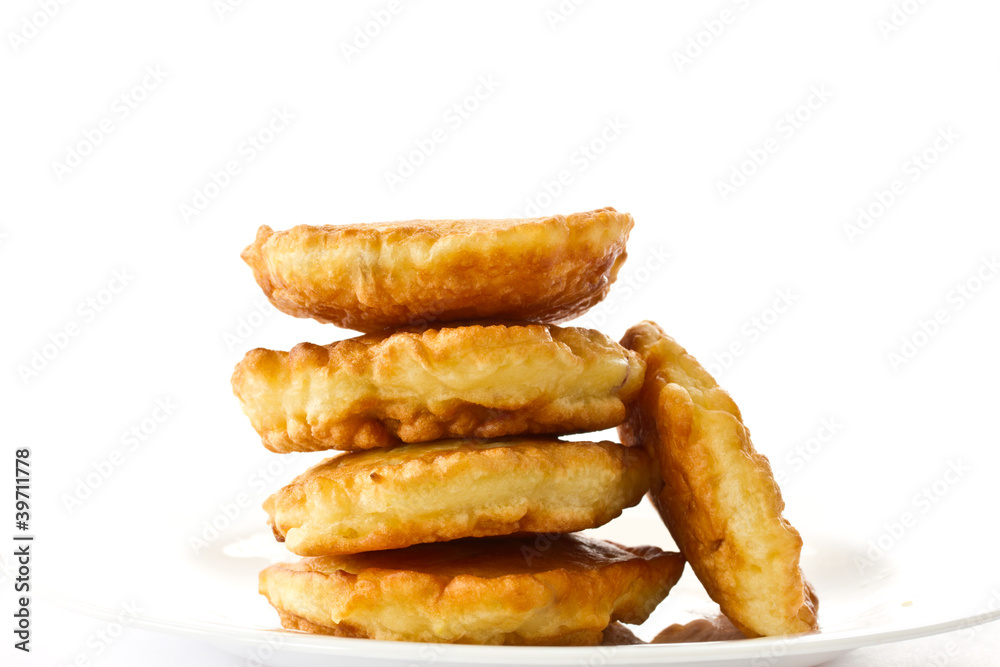 fried fritters on a white plate