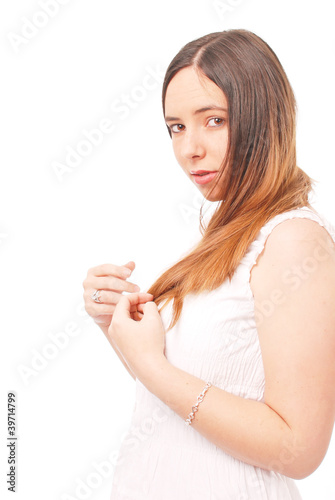 Girl in White Playing with Hair Against White Background