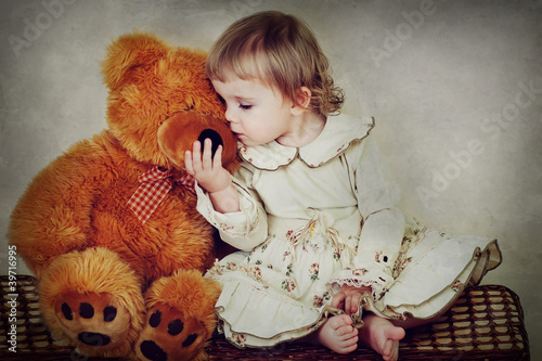 little girl with toy bear