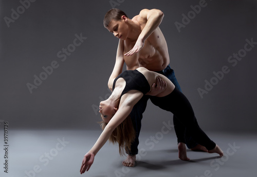 two young acrobats posing in dance