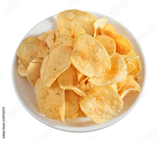 Potato chips heap on a plate, isolated on white