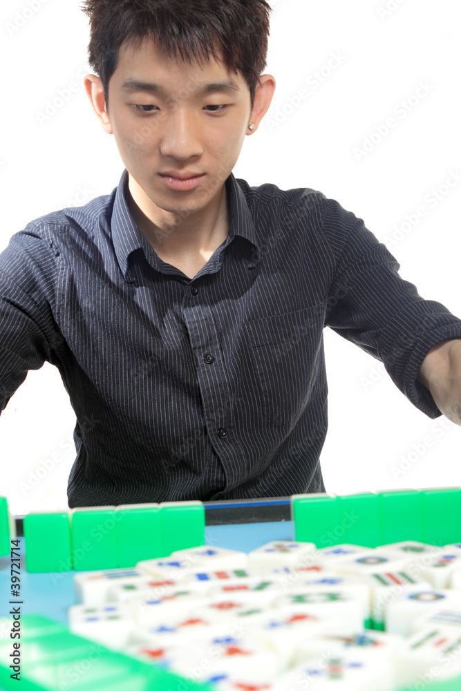 Fototapeta premium Chinese man play Mahjong, traditional China gamble.