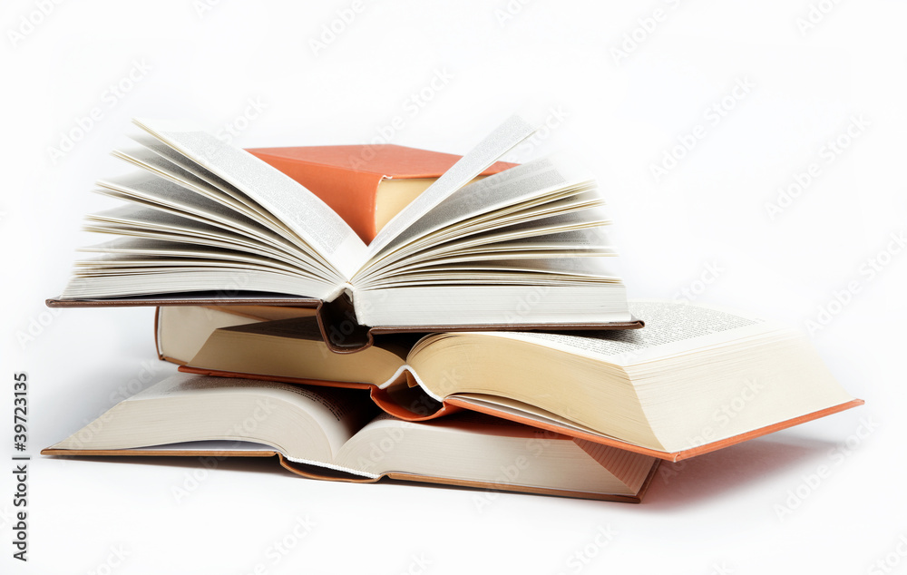 A stack of books on a white background. A stack of books on a white background.