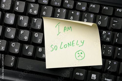 keyboard with 'I am so lonely' on it.