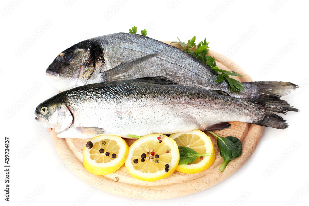 Fresh fishes with lemon, parsley and spice