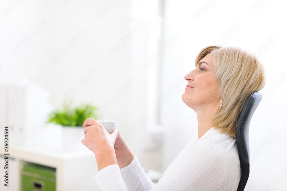 Portrait of dreaming senior business woman with cup of coffee Portrait of dreaming senior business woman with cup of coffee