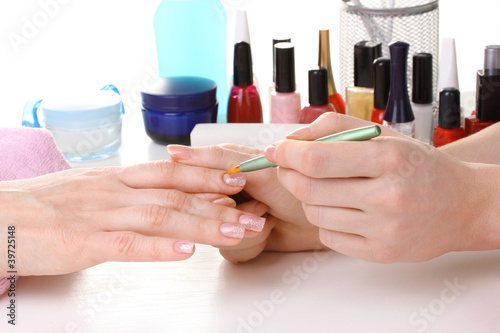 Manicure process in beautiful salon