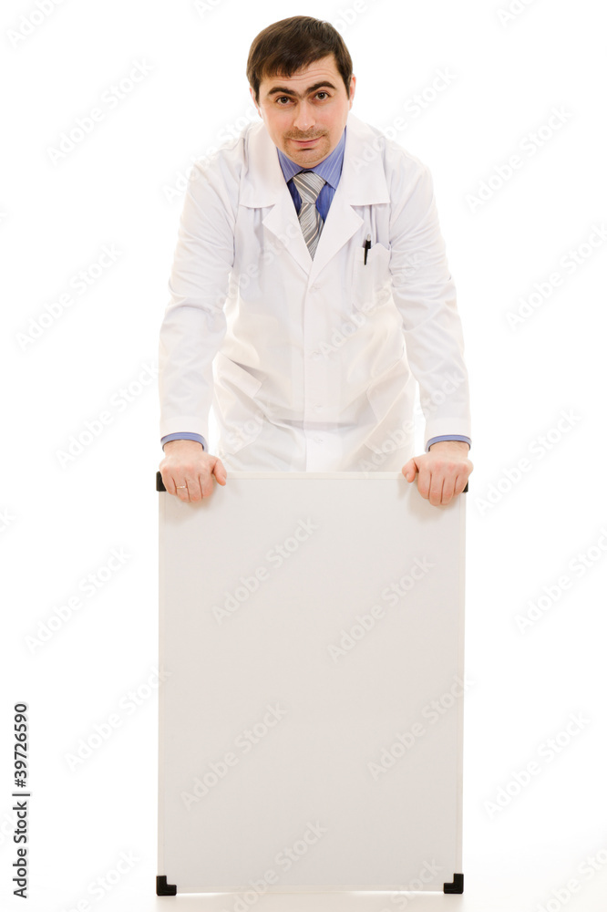 Male doctor with a white board on a white background. Male doctor with a white board on a white background.