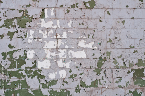 peeled off paint on brick wall