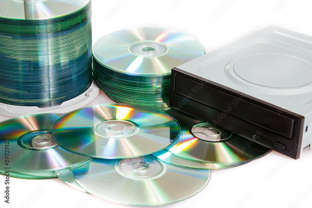 compact discs and burner on a white background compact discs and burner on a white background