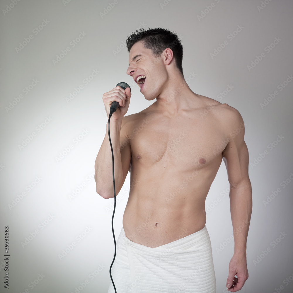 Fototapeta premium sexy man singing after his bath