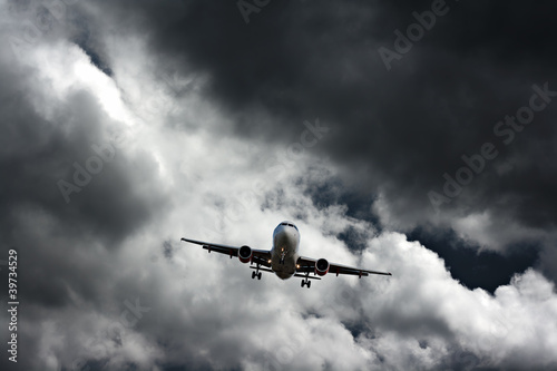 Passenger plane against stormy sky